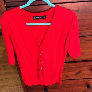 Short sleeved 100 cotton.  Large.  Great for covering sleeveless dresses.